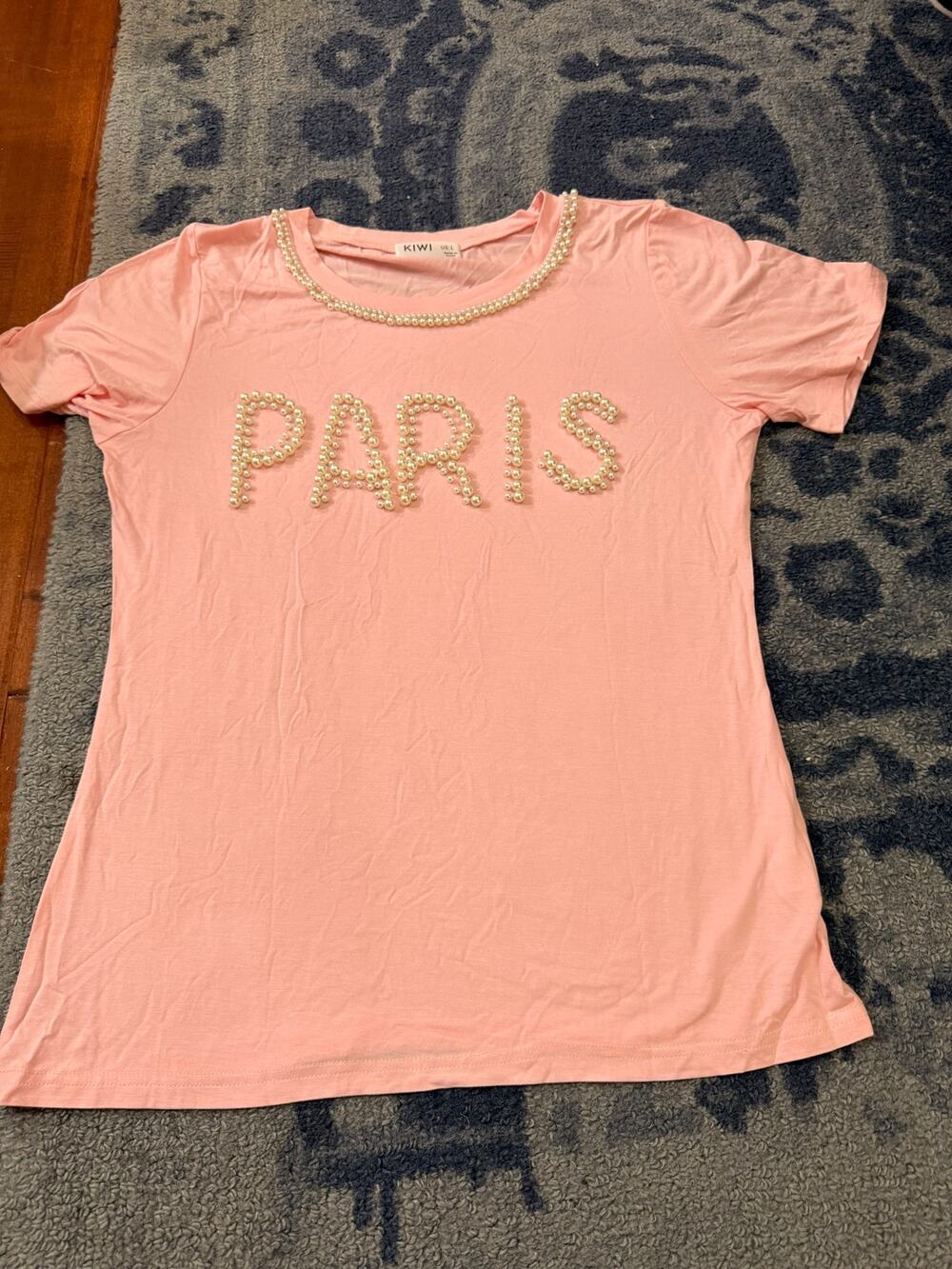 Kiwi Pearl embellished Paris text n pearl trim on neck.